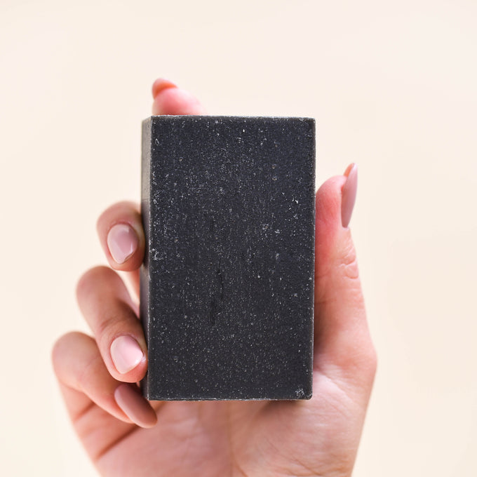 Charcoal soap in hand