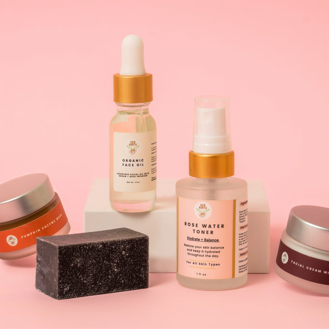 Image of EcoRoots skincare minikit, made of mini pumpkin mask, mini charcoal soap, mini rosewater toner, mini rosehip cream, mini face oil